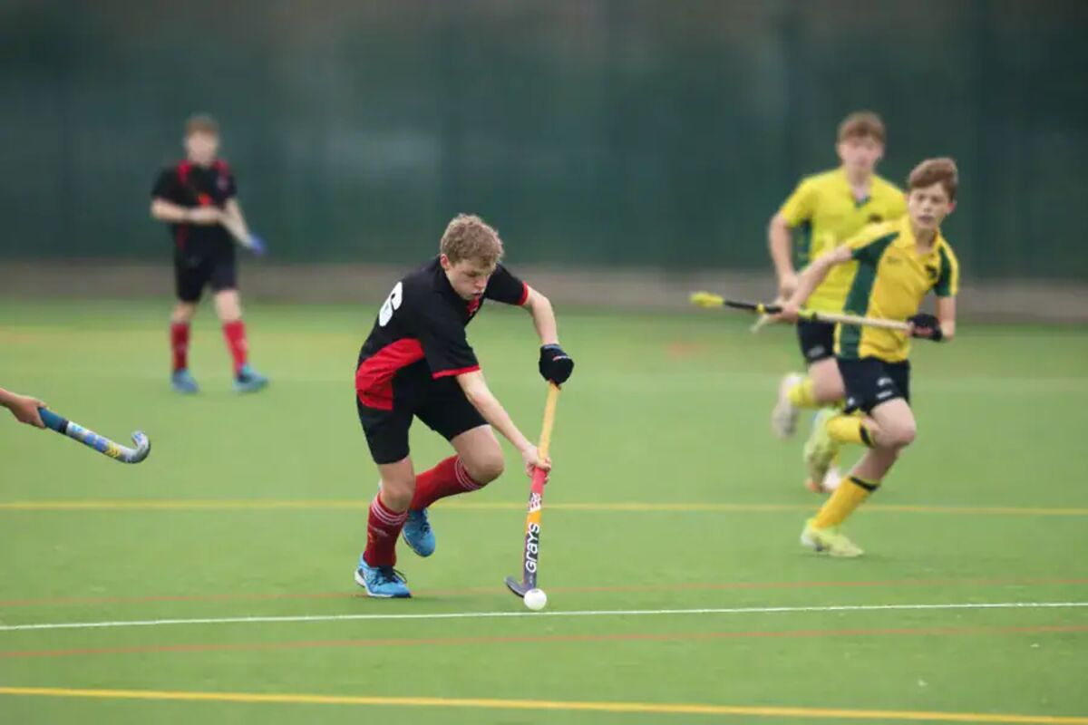 Rupert Bloor playing hockey